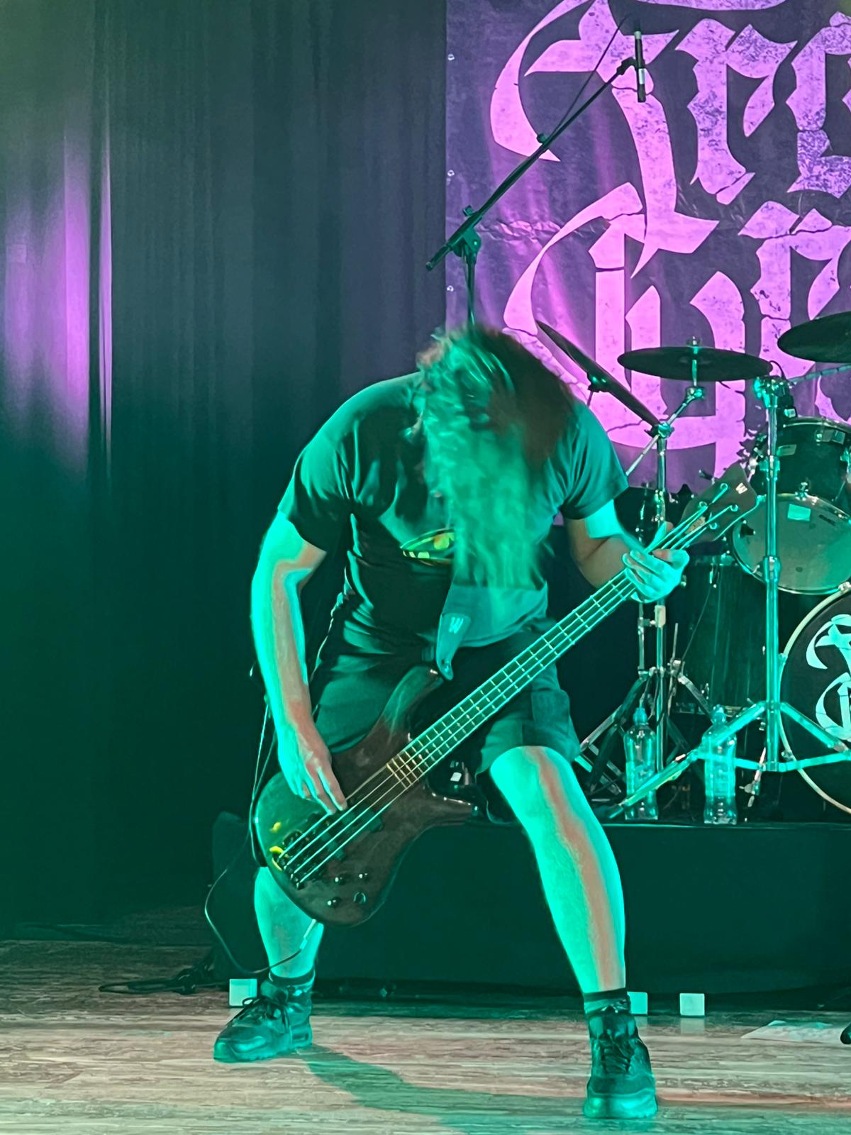 Enrico playing bass guitar live with From Grace