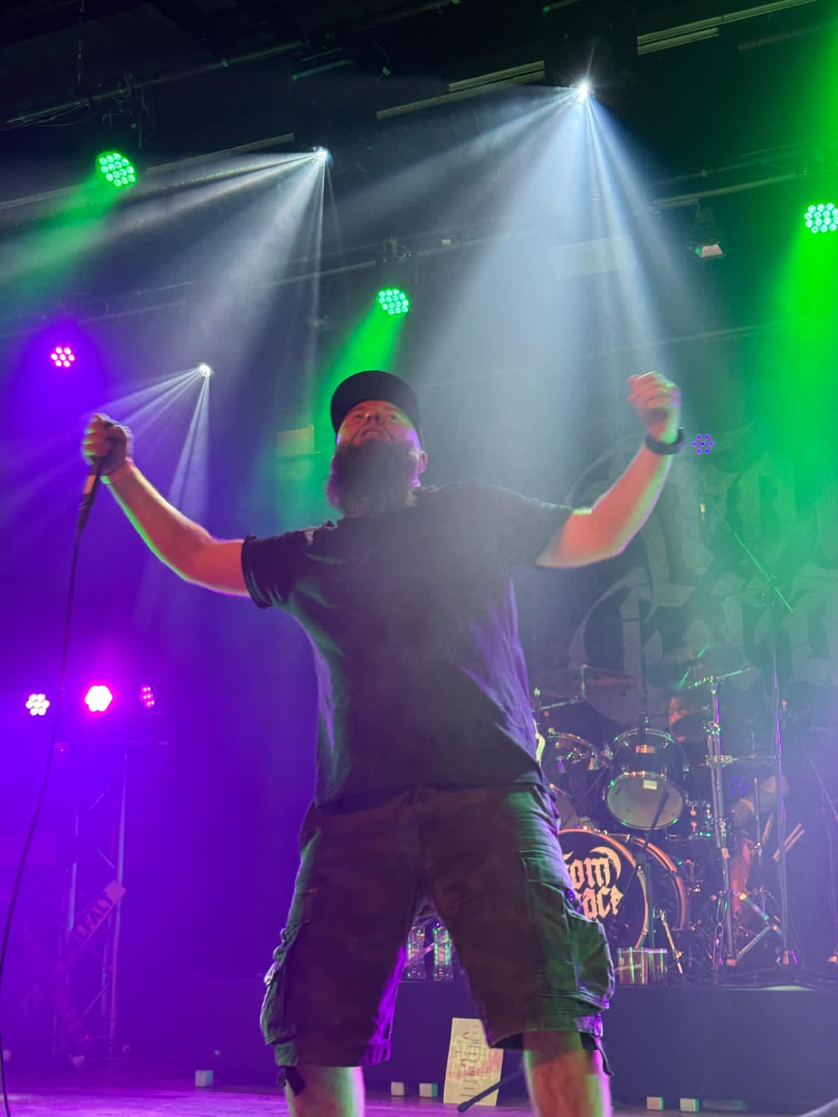 Jan performing aggressive death metal vocals on stage