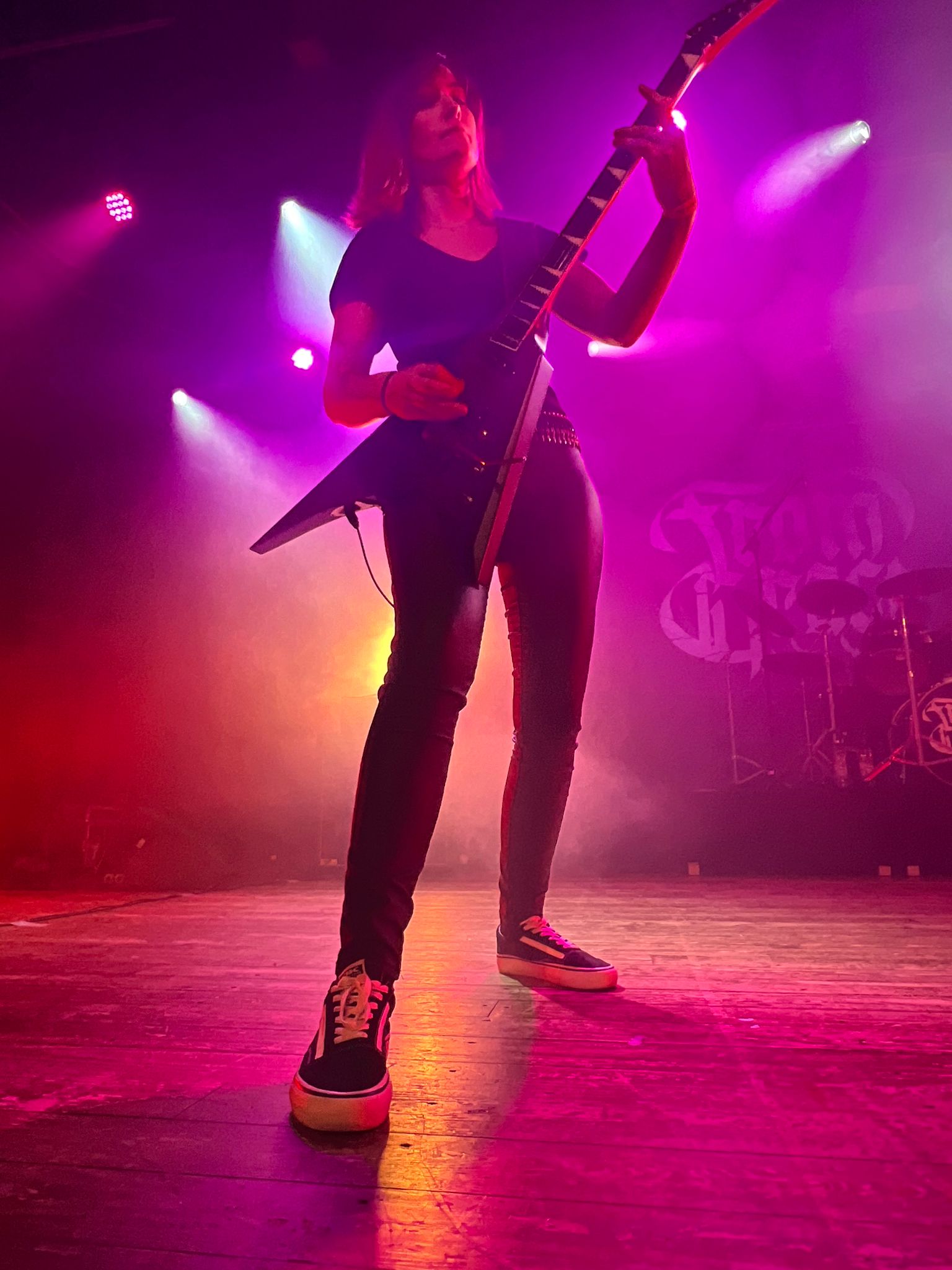 Jessi performing death metal rhythm guitar